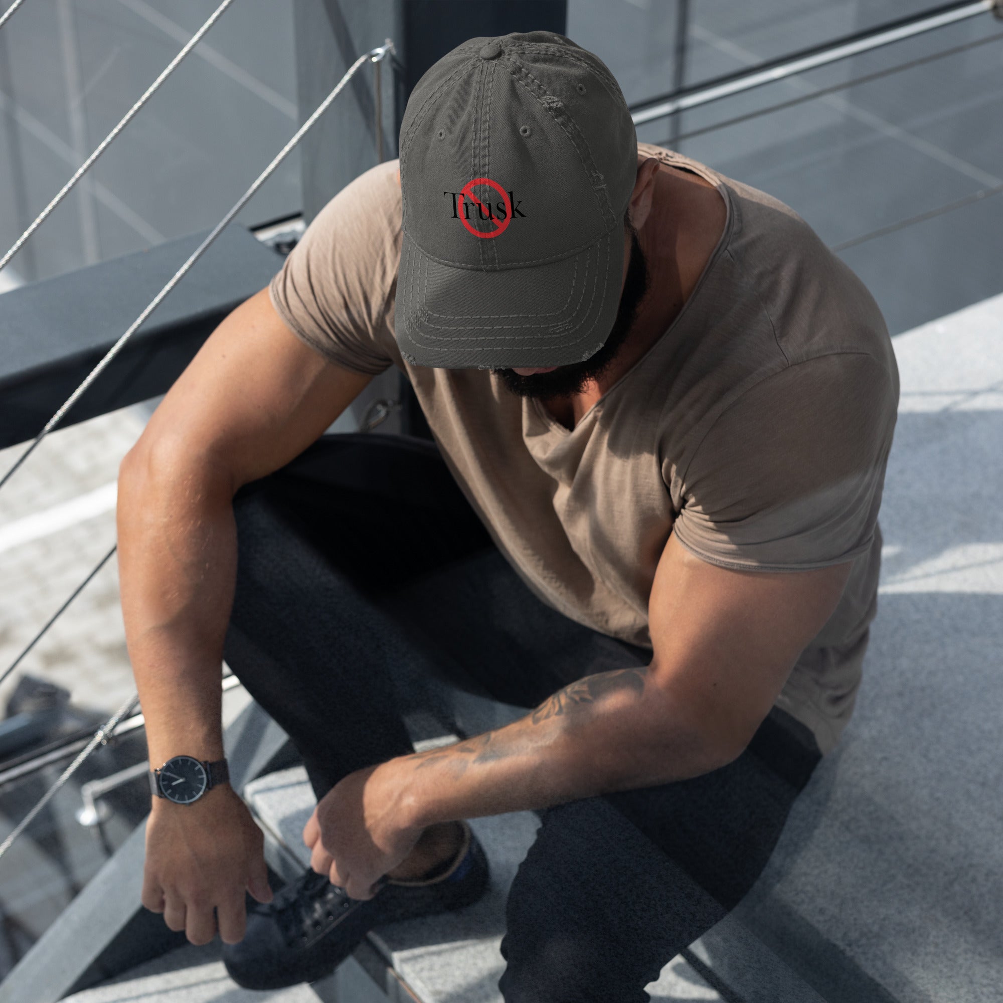 “Model wearing a Trusk logo cap (multiple colors available) from Detour.Store”