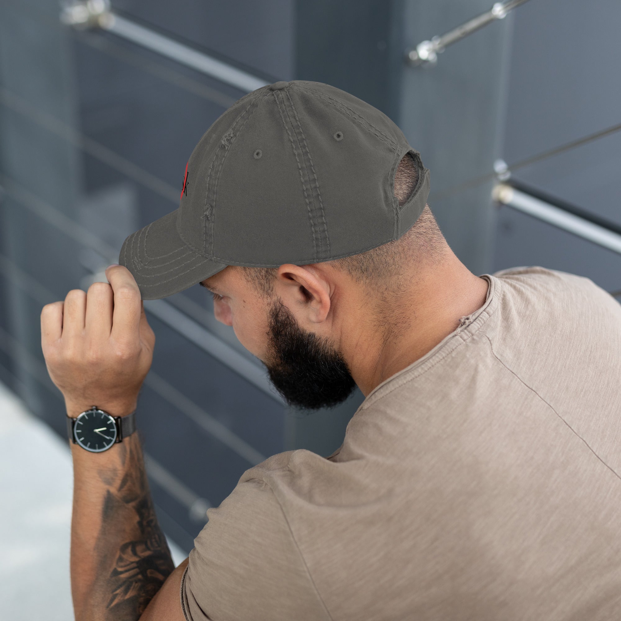 “Model wearing a Trusk logo cap (multiple colors available) from Detour.Store”