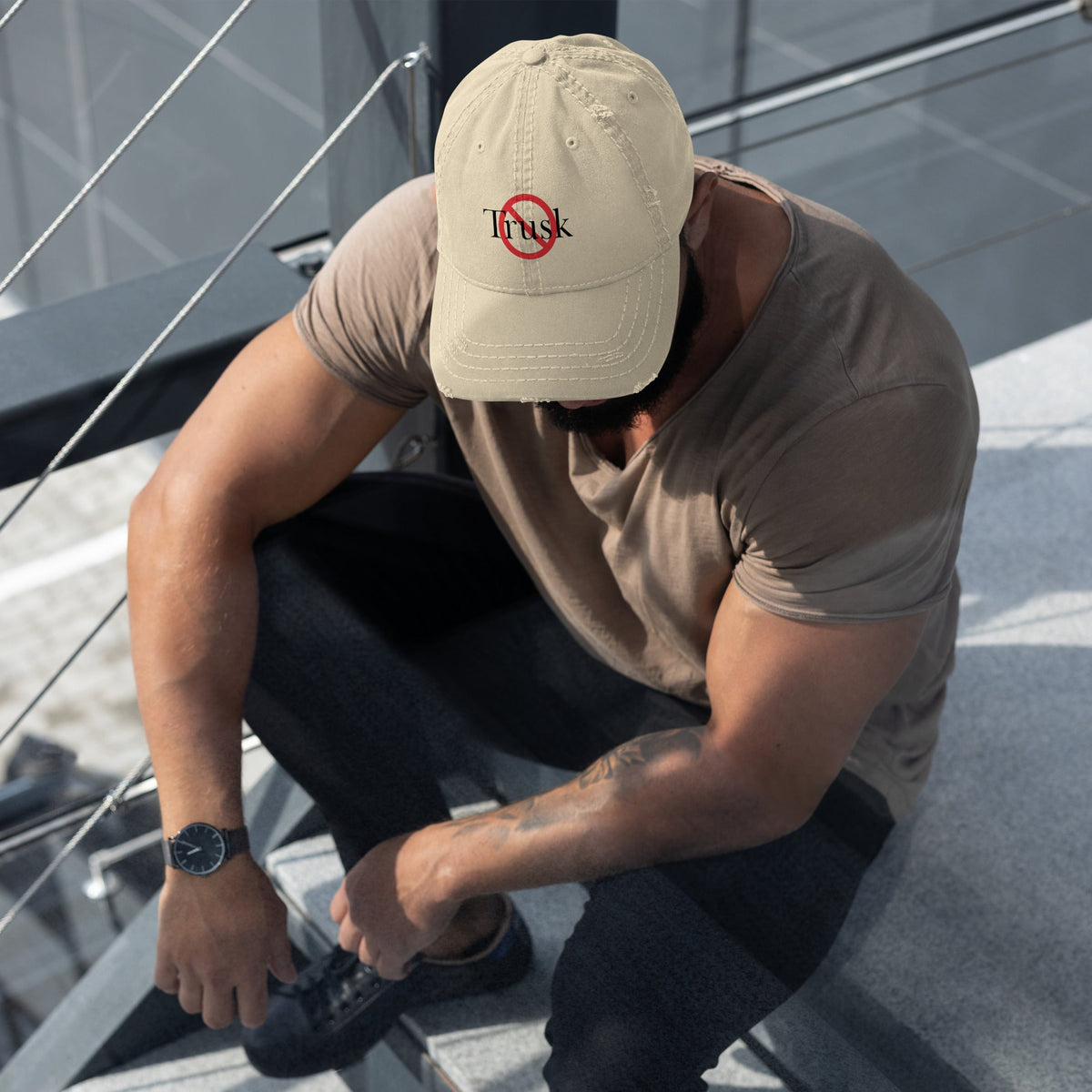 “Model wearing a Trusk logo cap (multiple colors available) from Detour.Store”ap