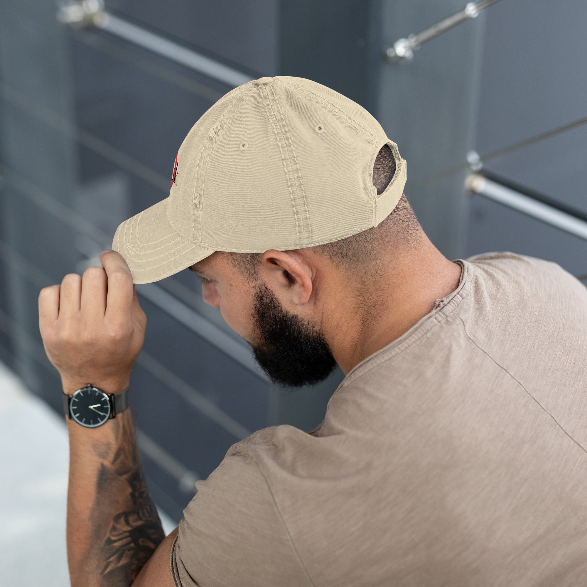 “Model wearing a Trusk logo cap (multiple colors available) from Detour.Store”