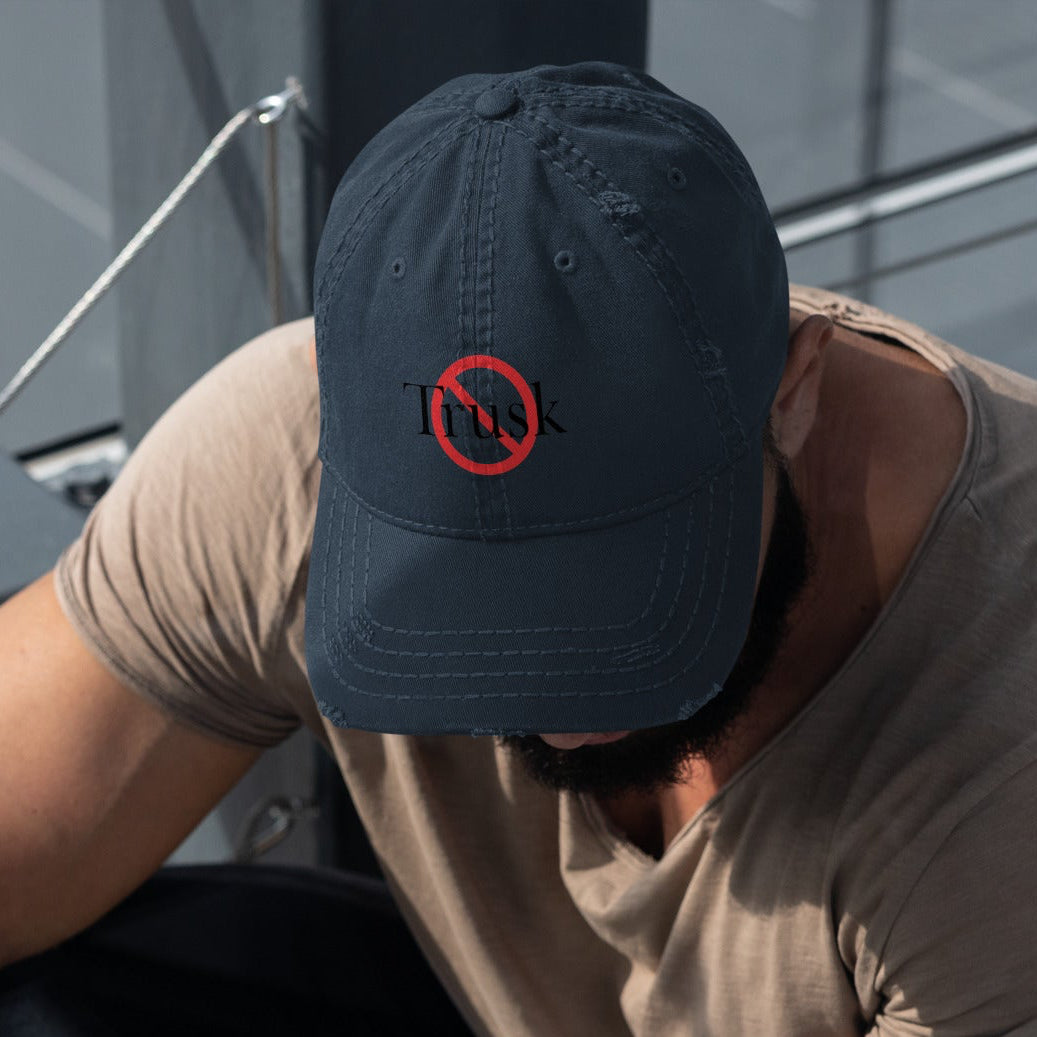“Model wearing a Trusk logo cap (multiple colors available) from Detour.Store”