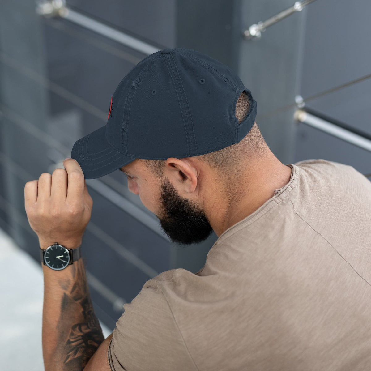 “Model wearing a Trusk logo cap (multiple colors available) from Detour.Store”