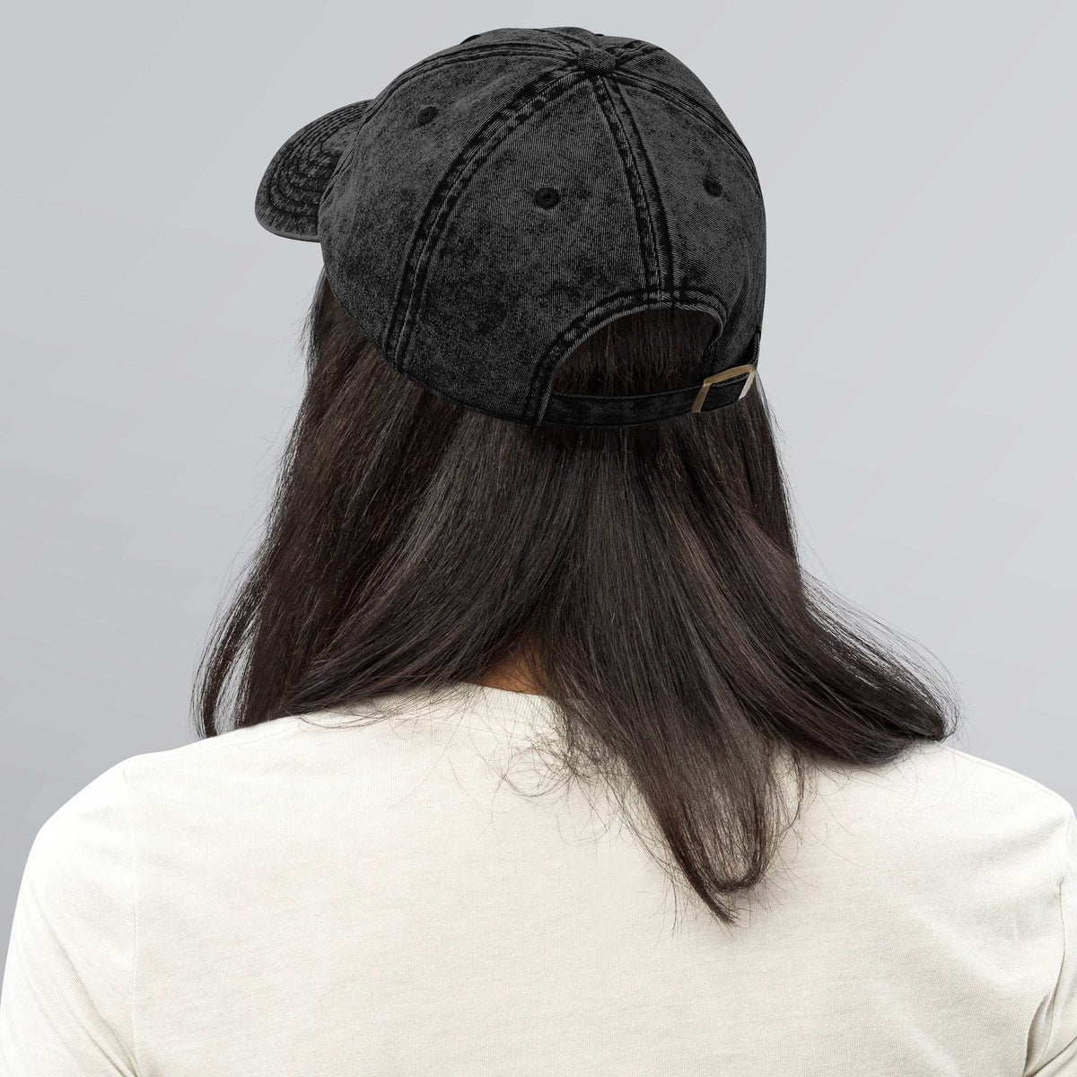 “Model wearing a Trusk logo cap (multiple colors available) from Detour.Store”