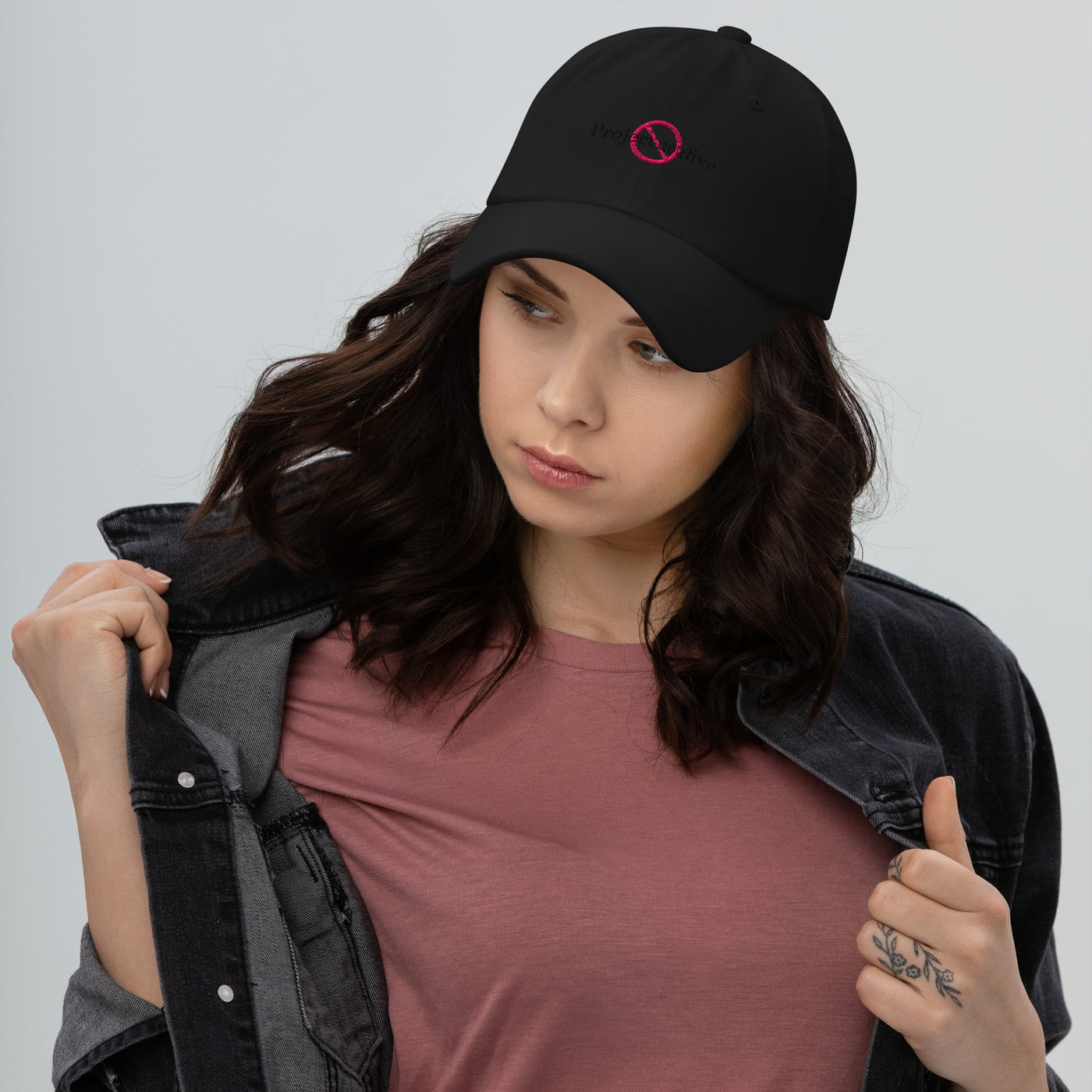 “Model wearing a No Project 2025 cap (multiple colors available) from Detour.Store”