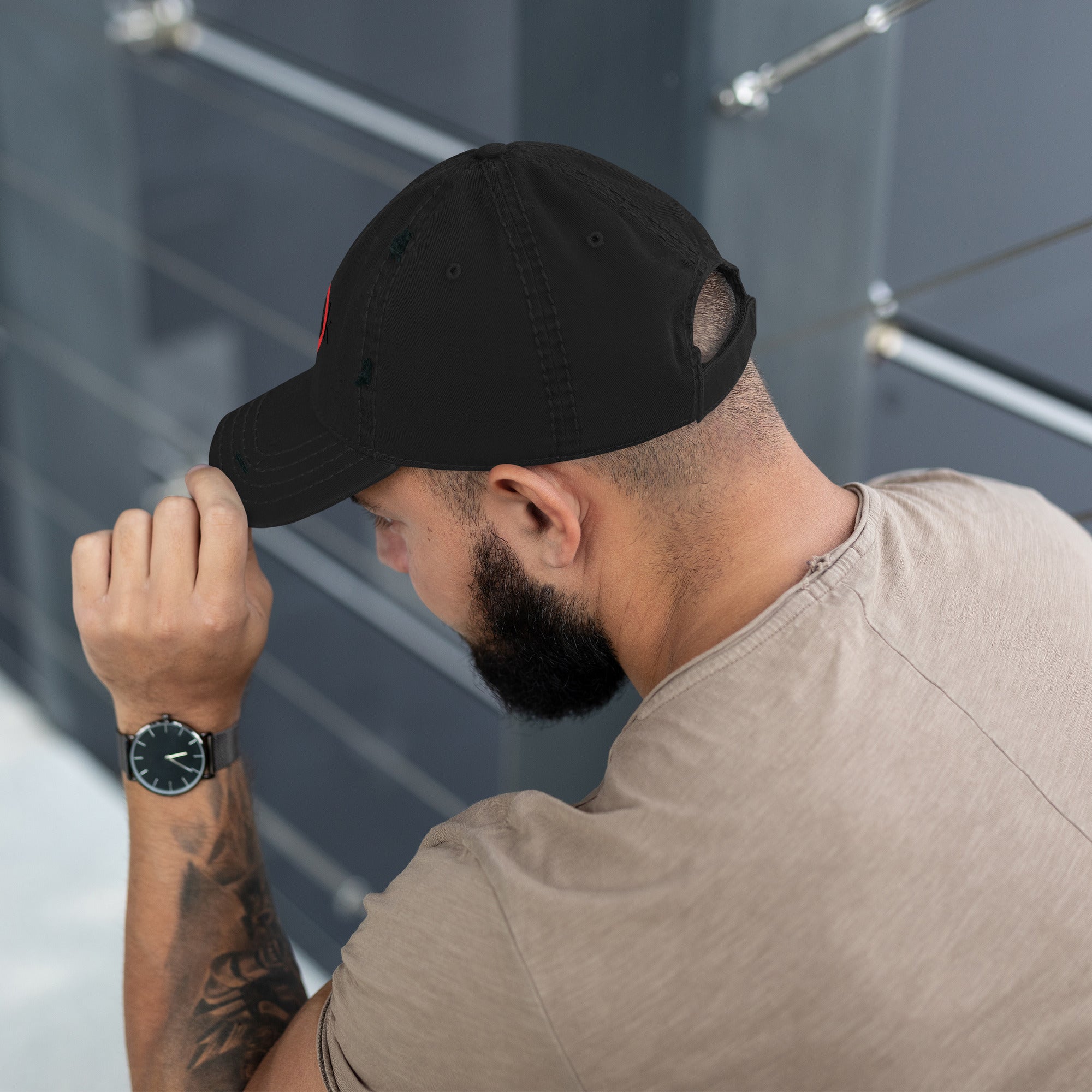 “Model wearing a Trusk logo cap (multiple colors available) from Detour.Store”