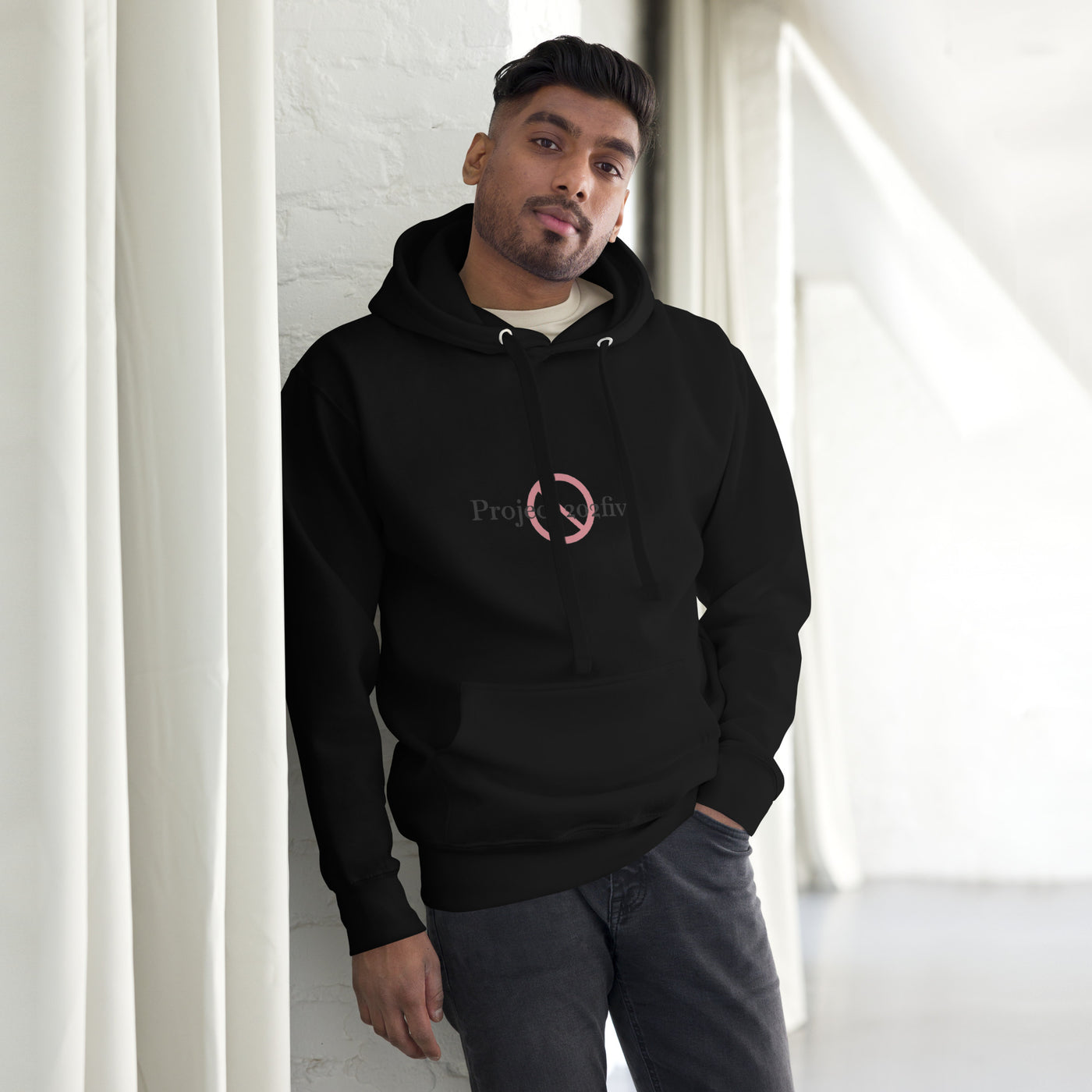 Male model wearing Project 2025 unisex hoodie with printed logo – multiple colors – DETOUR.STORE