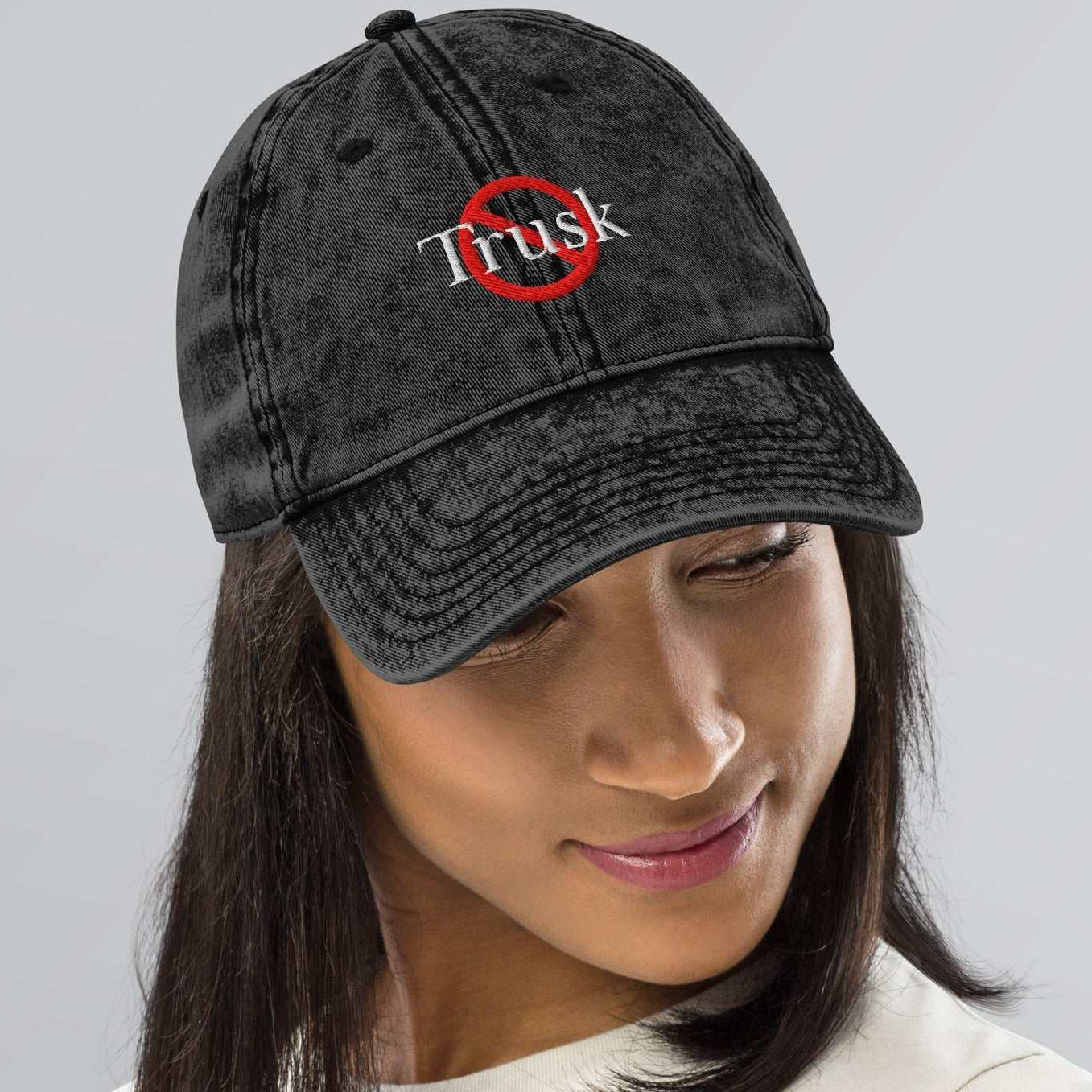 “Model wearing a Trusk logo cap (multiple colors available) from Detour.Store”