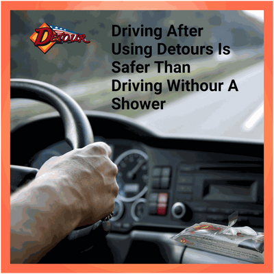 “Driver holding the steering wheel with a packet of Detour Driver Wipes on the dashboard, with text promoting cleanliness for safer driving.”