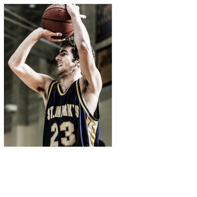 “Basketball player in a St. Mark’s number 23 jersey preparing to shoot the ball in an indoor gym.”